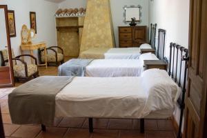 Postel nebo postele na pokoji v ubytování Cortijo del Coco