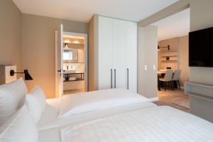 Postel nebo postele na pokoji v ubytování Hotel am Schlosspark garni