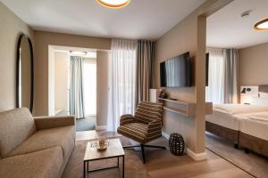 Postel nebo postele na pokoji v ubytování Hotel am Schlosspark garni