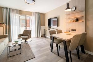 TV a/nebo společenská místnost v ubytování Hotel am Schlosspark garni