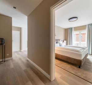 Postel nebo postele na pokoji v ubytování Hotel am Schlosspark garni