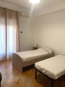 Postel nebo postele na pokoji v ubytování Casa Alighieri