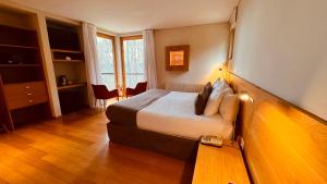 Cama ou camas em um quarto em Design Suites Bariloche