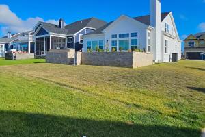 a large house with a lawn in front of it at Marlin Chase---30453 Madeira Ln in Ocean View