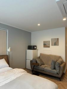 Ένα ή περισσότερα κρεβάτια σε δωμάτιο στο the one ueno +4 φωτογραφίες