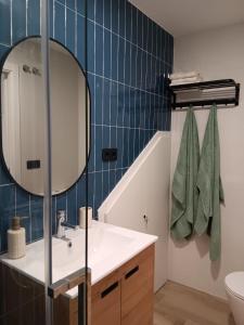 a bathroom with a sink and a mirror at Casa Loureiro in Redondela
