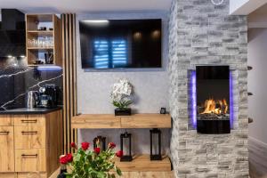 Kuchyňa alebo kuchynka v ubytovaní Apartament TatraVika z basenem i widokiem