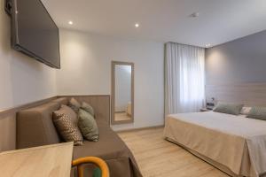Postel nebo postele na pokoji v ubytování Hotel Casanova