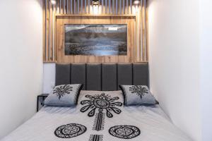 Posteľ alebo postele v izbe v ubytovaní Apartament TatraVika z basenem i widokiem
