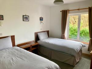 Doonbeg Holiday Cottages 객실 침대