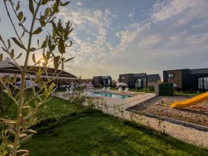 a resort with a pool and a slide at Serenity Village Belek in Belek