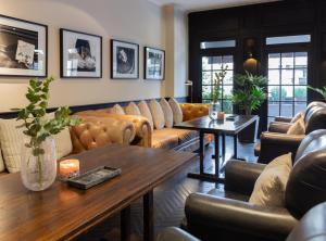 a living room with couches and a table at Casa Chic Palermo Hotel Boutique in Buenos Aires