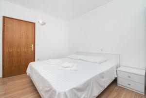 Postel nebo postele na pokoji v ubytování Apartment Ljuba