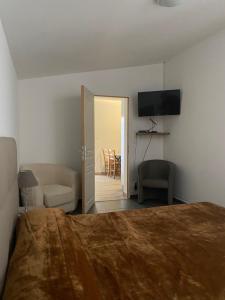 En eller flere senge i et værelse på Résidence "Hotel Beausoleil"