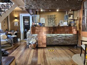 a living room with a stone fireplace in a house at Hotel Boutique Terra Diaguita & Spa in La Serena