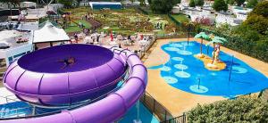 a water park with a large purple inflatable slide at Elite Retreat Blackpool in Blackpool