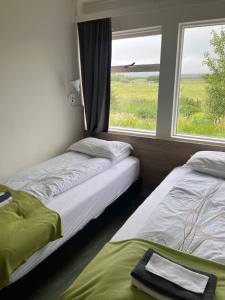 Katil atau katil-katil dalam bilik di Eidavellir Apartments and Rooms