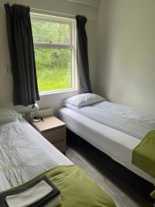 Katil atau katil-katil dalam bilik di Eidavellir Apartments and Rooms