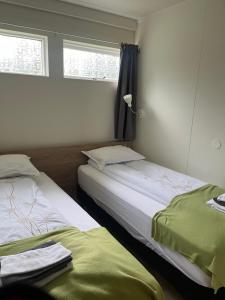 Katil atau katil-katil dalam bilik di Eidavellir Apartments and Rooms