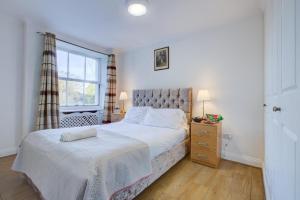 Postel nebo postele na pokoji v ubytování Streathem Hotel