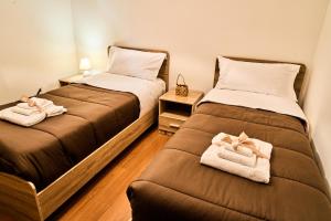 Llit o llits en una habitació de La Dimora dei Giganti