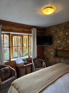 Postel nebo postele na pokoji v ubytování Hotel Boutique Terra Diaguita & Spa