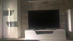 a television sitting on top of a white cpu at Magic Paradisus guest in Caniço