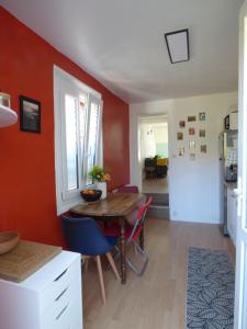 a kitchen and dining room with a table and chairs at Chez Suzie in Le Tréport