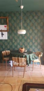 a dining room with a table and two chairs at Casa Rochafrida in Ossa de Montiel