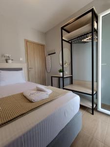 a bedroom with a large bed and a large mirror at Dimitra#RelaxHomeKallithea in Kallithea Halkidikis