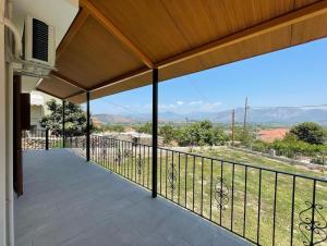 a balcony of a house with a view at Maison Olga in Valanidorachi