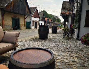 a large barrel sitting on a cobblestone street at PodRoom Irena in Zmajevac +10 photos