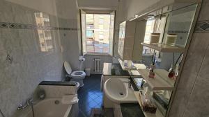 a bathroom with a sink and a toilet and a mirror at casa Aldini in Rome +37 photos