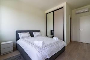 Letto o letti in una camera di Libera Luxe Residence