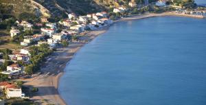 an aerial view of a beach next to the water at Seaside Serenity in Komi Beach! in Kómi