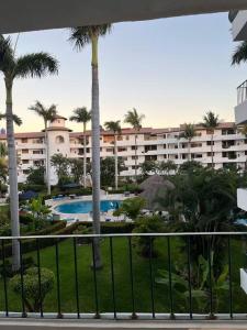 a view of a hotel from the balcony of a resort at Condominio Marina Vallarta in Puerto Vallarta