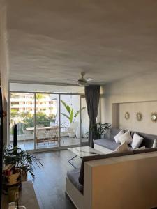 a living room with a couch and a table at Condominio Marina Vallarta in Puerto Vallarta +14 photos
