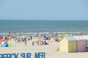 a large group of people on a beach at Studio, 50m de la plage, RDC in Berck-sur-Mer