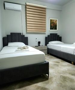 Postel nebo postele na pokoji v ubytování Perandori Apartments Vlorë Old Beach