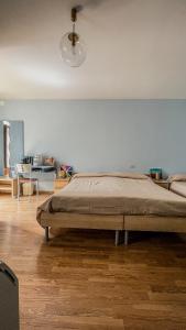 a bedroom with a large bed in a room at Borgo Insieme in San Donato Val di Comino