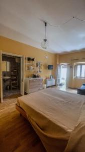 a large bedroom with a large bed in a room at Borgo Insieme in San Donato Val di Comino