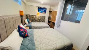 Postelja oz. postelje v sobi nastanitve intikilla hostal