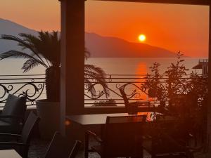 a view of a sunset from a balcony at Hotel Majestic in Vlorë