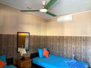 Postel nebo postele na pokoji v ubytování Lita Homestay