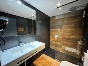 a bathroom with a large tub and a toilet at New "Villa Albero" Boutique in Torremolinos