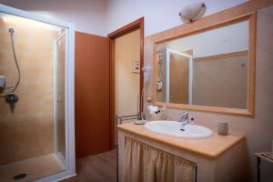 a bathroom with a sink and a shower at Fior di Pesco in Sommacampagna +60 photos