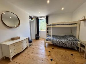 a bedroom with a bunk bed and a mirror at Casa Arena Authentique maison de village avec piscine au cœur de l’Alta Rocca - Zoza in Zoza +74 photos
