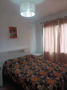 En eller flere senge i et værelse på Complejo Médanos I