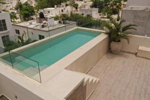 Kolam renang di atau dekat dengan VILLAS TULUM ideal para nomadas digitales