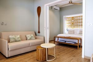 Postel nebo postele na pokoji v ubytování Niu Beach Hôtel Moorea